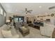 Open living room featuring comfortable seating and views to the kitchen and dining area at 13097 Rinella St, Venice, FL 34293