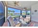 Relaxing screened porch overlooking the lake with comfortable seating at 13097 Rinella St, Venice, FL 34293