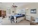 Bright bedroom with a ceiling fan, cottage decor, and comfortable furnishings at 6405 Gulf Dr, Holmes Beach, FL 34217