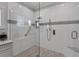 Modern walk-in shower featuring stylish tile work, glass enclosure, and bench seating at 6405 Gulf Dr, Holmes Beach, FL 34217