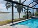 Screened in pool and spa offer beautiful water views at 254 Toscavilla Blvd, Nokomis, FL 34275