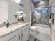 Elegant bathroom with granite countertops and a mermaid-themed shower at 254 Toscavilla Blvd, Nokomis, FL 34275