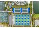 Aerial view of community amenities including pickleball courts, tennis courts, and a resort-style pool at 26056 Seastone Dr, Englewood, FL 34223