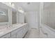 Double vanity bathroom with a large shower at 26056 Seastone Dr, Englewood, FL 34223