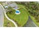 Community dog park with fenced area, shade structure, and walking path at 26056 Seastone Dr, Englewood, FL 34223