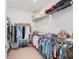 Large walk-in closet with ample shelving and hanging space at 26056 Seastone Dr, Englewood, FL 34223