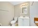 Updated bathroom featuring a toilet, sink, and shower at 1323 Karen Dr, Venice, FL 34285