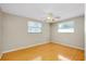 Bright bedroom with wood-look floors and ceiling fan at 1323 Karen Dr, Venice, FL 34285