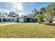 Single story house with a green exterior and a well-manicured lawn at 1323 Karen Dr, Venice, FL 34285