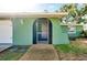 Front entrance with a screen door and a paved walkway at 1323 Karen Dr, Venice, FL 34285