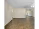 Living room with tile floor and view of kitchen at 1323 Karen Dr, Venice, FL 34285