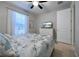 Comfortable bedroom with a queen-size bed and large window at 19764 Ortona St, Venice, FL 34293