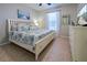 Primary bedroom with a king-size bed and ample dresser space at 19764 Ortona St, Venice, FL 34293