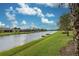 Scenic view of canal with lush landscaping at 19764 Ortona St, Venice, FL 34293