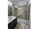 Updated bathroom with a large walk-in shower and modern vanity at 20428 Lagente Cir, Venice, FL 34293