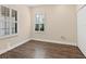 Well-lit bedroom with wood flooring and plantation shutters at 21621 Winter Park Ct, Venice, FL 34293