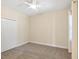 Bright bedroom with neutral walls, carpeting, and a double door closet at 21621 Winter Park Ct, Venice, FL 34293