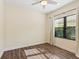 Bright bedroom with hardwood floors and window with blinds at 21621 Winter Park Ct, Venice, FL 34293