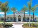 Community clubhouse with palm trees and ample parking at 21621 Winter Park Ct, Venice, FL 34293