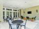 Outdoor community room with seating and tables at 21621 Winter Park Ct, Venice, FL 34293