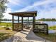 Covered fishing pier with scenic lake views at 21621 Winter Park Ct, Venice, FL 34293