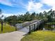 Wooden footbridge leads to Lookout Point Island at 21621 Winter Park Ct, Venice, FL 34293