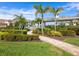 Landscaped pool area with a walkway, gazebo, and lush greenery at 21621 Winter Park Ct, Venice, FL 34293