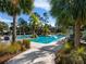 Relaxing community pool with a thatched roof cabana at 21621 Winter Park Ct, Venice, FL 34293