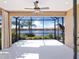 Expansive screened lanai overlooking a peaceful lake and conservation area at 21621 Winter Park Ct, Venice, FL 34293