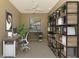 Home office with desk, shelving, and window views at 2331 Harrier Way, Nokomis, FL 34275