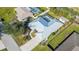 Bird's-eye view showing house, pool, and surrounding area at 23442 Moreland Ave, Port Charlotte, FL 33954