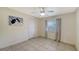 Simple bedroom with ceiling fan and tiled floors at 23442 Moreland Ave, Port Charlotte, FL 33954