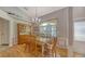 Bright dining room with hardwood floors and a wooden table at 23442 Moreland Ave, Port Charlotte, FL 33954