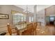 Dining area with hardwood floors and wooden table and chairs at 23442 Moreland Ave, Port Charlotte, FL 33954