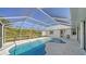 Inviting kidney-shaped pool with screened enclosure at 23442 Moreland Ave, Port Charlotte, FL 33954