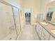 Bathroom boasts double sinks, granite countertops, and a walk-in shower at 2501 Sherman Oak Dr, North Port, FL 34289