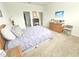 Spacious bedroom with ample natural light and room for a dresser at 2501 Sherman Oak Dr, North Port, FL 34289