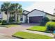 Two-story home with a two-car garage and landscaping at 2501 Sherman Oak Dr, North Port, FL 34289