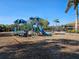 Community playground with playset and wood chips at 2501 Sherman Oak Dr, North Port, FL 34289