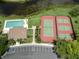 Aerial view of community pool and tennis/pickleball courts at 614 May Apple Way, Venice, FL 34293