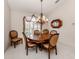 Bright dining room with a round table and six chairs at 614 May Apple Way, Venice, FL 34293