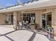 Outdoor patio with seating area, adjacent to the house at 614 May Apple Way, Venice, FL 34293