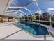 Relaxing screened-in pool and patio area perfect for outdoor entertaining at 614 May Apple Way, Venice, FL 34293