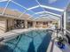 Inviting screened-in pool area with patio furniture and a spacious deck at 614 May Apple Way, Venice, FL 34293