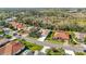 Aerial shot of a residential street and the roofs of tile homes at 6930 Treymore Ct, Sarasota, FL 34243