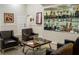 Comfortable clubhouse seating area with trophies displayed in mirrored shelving at 6930 Treymore Ct, Sarasota, FL 34243