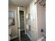 Bathroom featuring an open doorway, built in storage, a shower, and modern fixtures at 789 N Green Cir, Venice, FL 34285