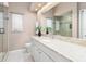 Bathroom with granite countertop, large mirror, and walk-in shower at 824 Blue Crane Dr, Venice, FL 34285