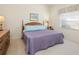 Spacious bedroom with a king-size bed and wood dresser at 824 Blue Crane Dr, Venice, FL 34285