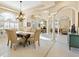 Formal dining room with a chandelier and seating for six at 824 Blue Crane Dr, Venice, FL 34285